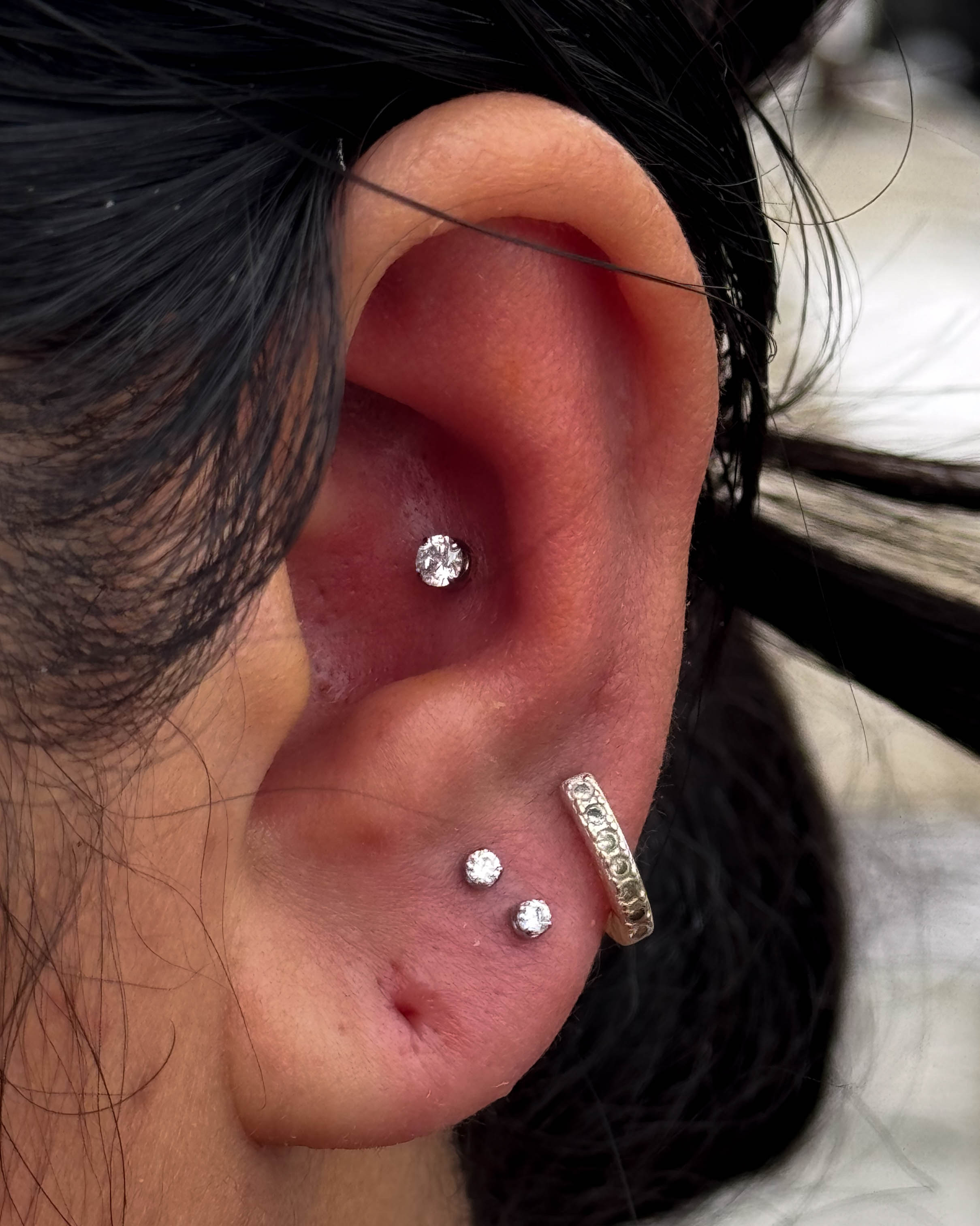 Conch and lobe piercing combination by Stab Daddy Bri