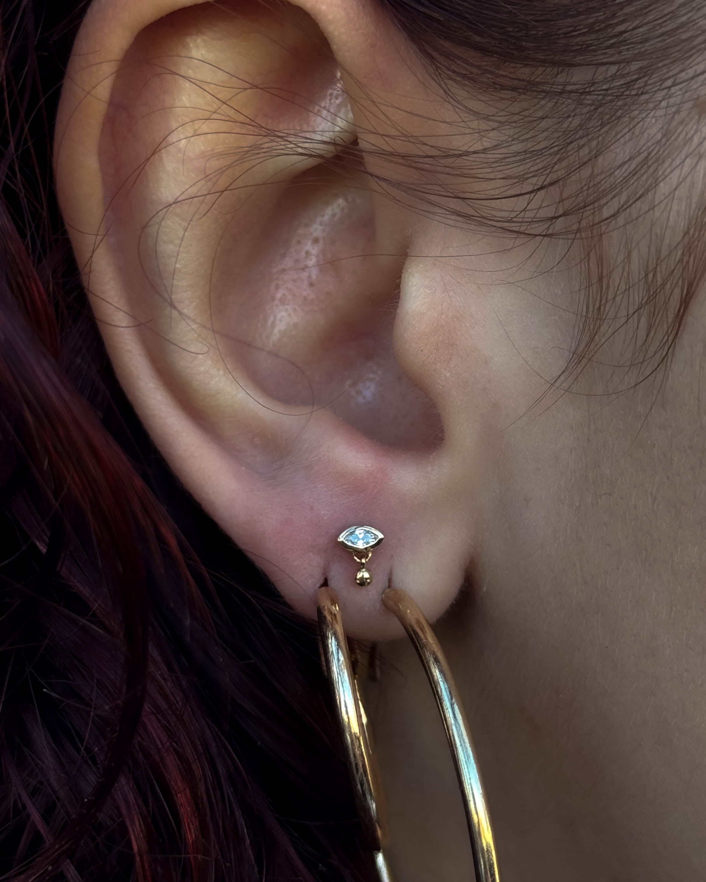Ear curation with gold jewellery by Stab Daddy Bri, Oxford