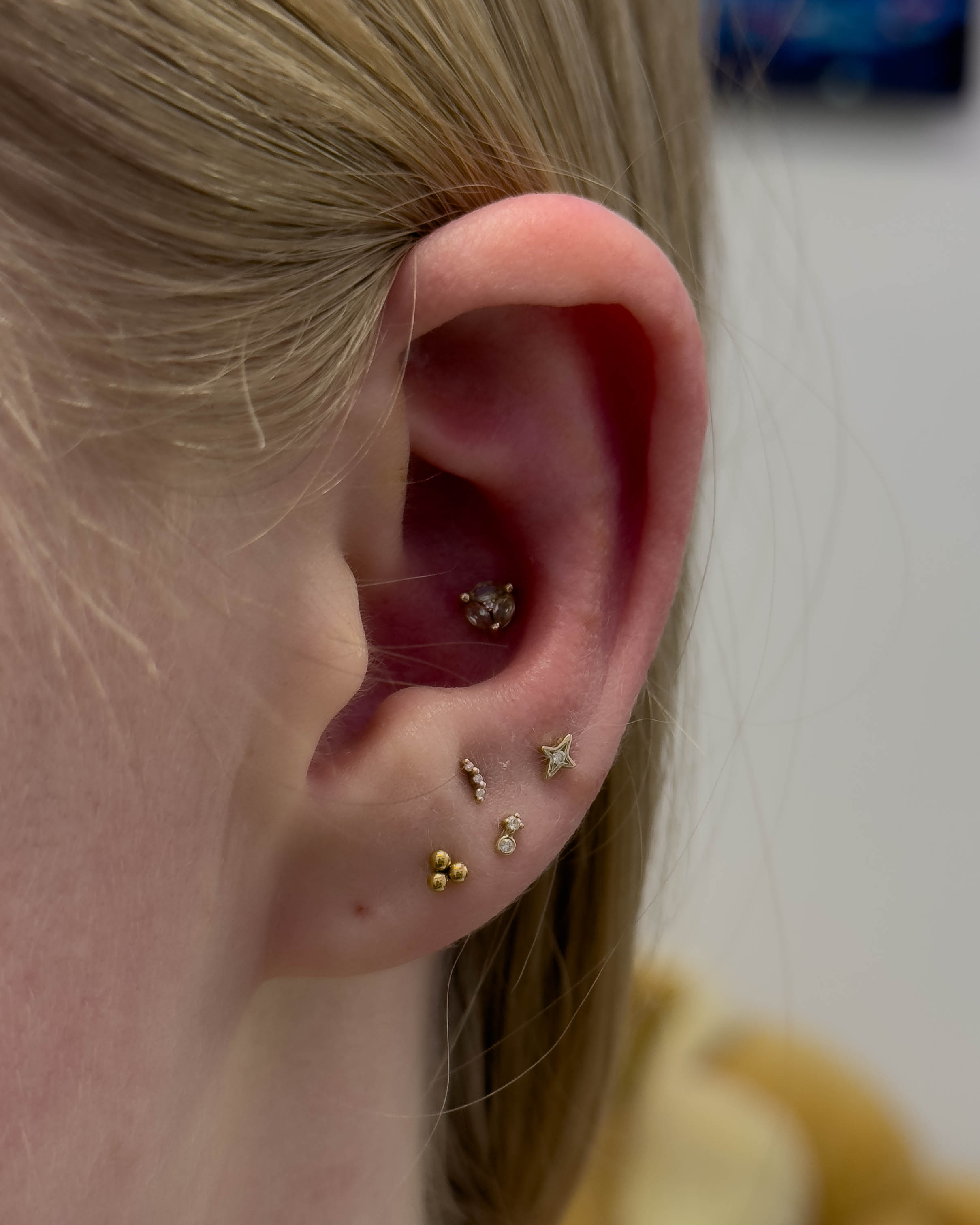 Triple ear piercing by Stab Daddy Bri