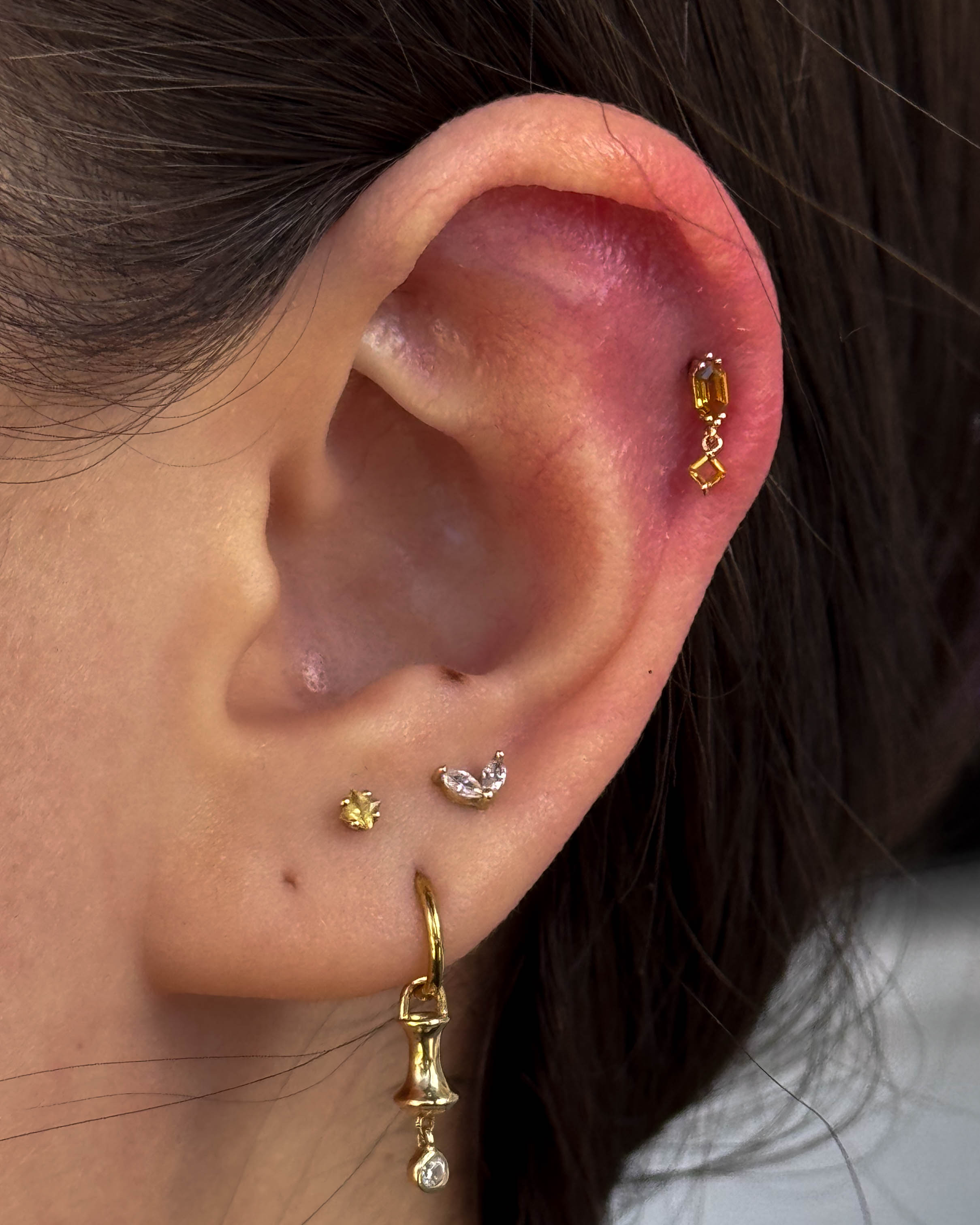 Healed ear curation with gold jewellery by Stab Daddy Bri