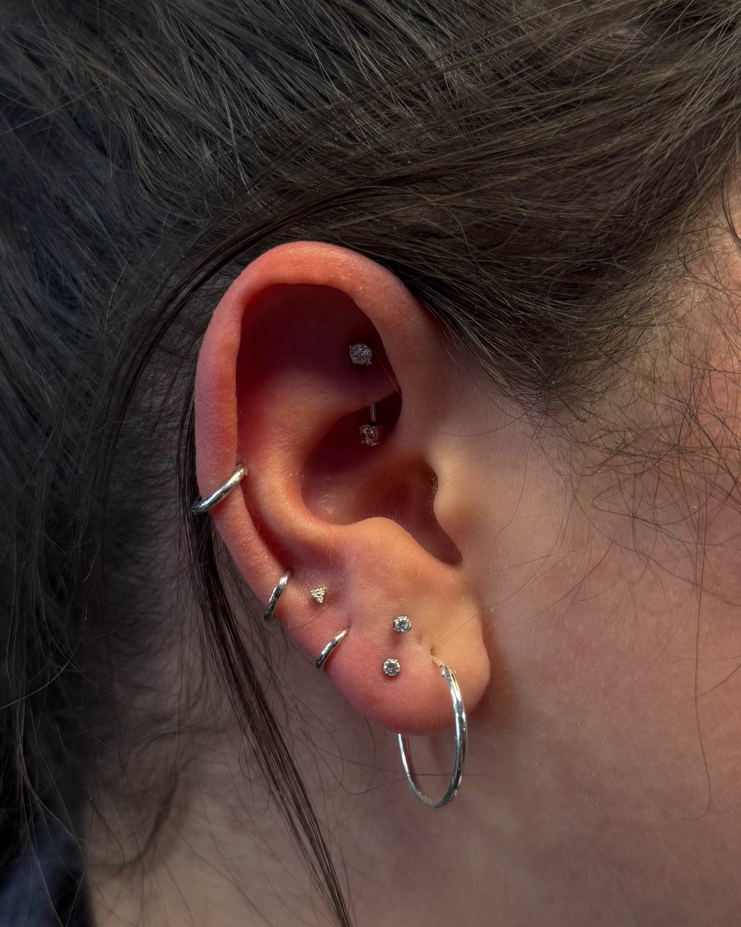 Rook piercing with titanium jewellery by Stab Daddy Bri